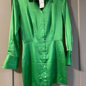 Beautiful green mini dress! Brand new! Shoulder pads. French cuff sleeves.